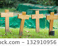 nameless wooden crosses on a meadow 132910956