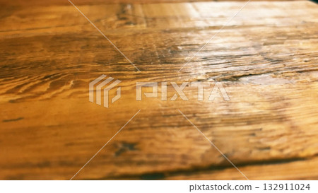 Macro texture of treated hardwood table surface in cafe interior Macro texture of treated hardwood table surface in cafe interior 132911024
