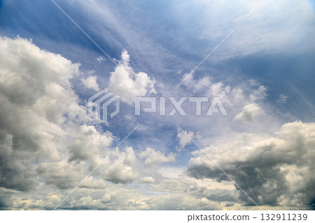 A Dramatic and Beautiful Cloudscape Paints the Sky Above with a Vibrant Blue Color 132911239