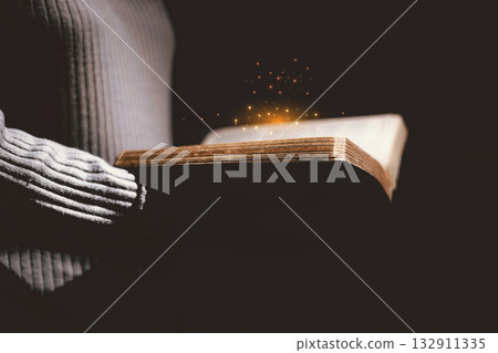 Open Bible glowing with golden light, symbolizing the Word of God, faith, prayer, hope, spiritual guidance, Christianity, holy scripture, wisdom, divine inspiration and eternal truth. Open Bible glowing with golden light, symbolizing the Word of God, faith, prayer, hope, spiritual guidance, Christianity, holy scripture, wisdom, divine inspiration and eternal truth. 132911335