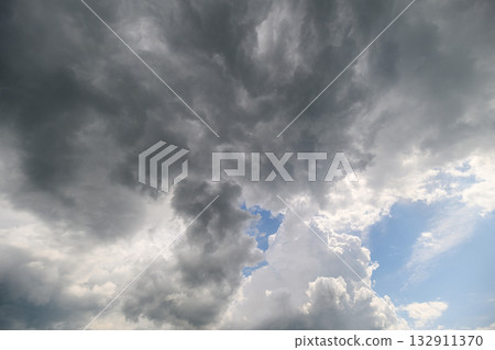 A Dramatic Sky Featuring Both Dark and Light Clouds Creates a Stunning Atmosphere A Dramatic Sky Featuring Both Dark and Light Clouds Creates a Stunning Atmosphere 132911370