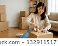 Lifestyle of a young woman preparing to move indoors 132911517