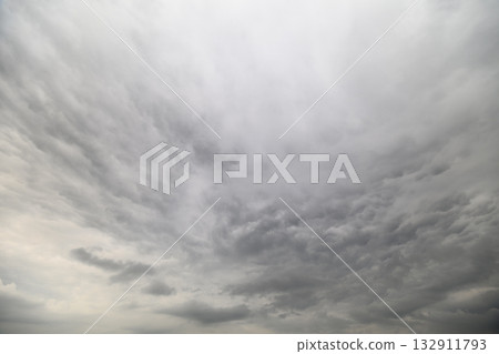 A Large and Dramatic Overcast Sky Featuring Dark, Brooding Clouds Full of Emotion and Depth 132911793