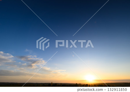 A Stunning Sunrise That Lights Up the Peaceful Horizon, Setting a Perfect Mood for Day A Stunning Sunrise That Lights Up the Peaceful Horizon, Setting a Perfect Mood for Day 132911850