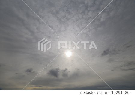 A Dramatic Cloudy Sky with the Sun eversobeautifully Peeking Through the Clouds 132911863