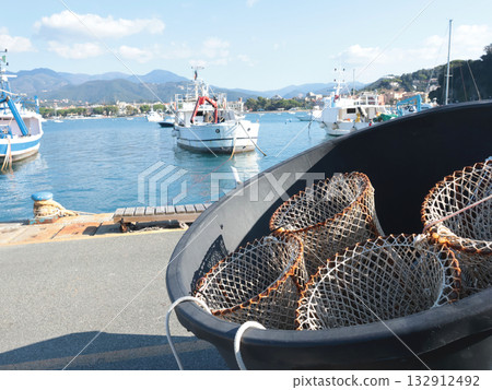 Metal nets in port. Fishing and sea vessels. Boats in marina. Metal nets in port. Fishing and sea vessels. Boats in marina. 132912492