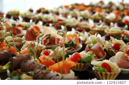 Appetizers setting on the white plates served for food reception Appetizers setting on the white plates served for food reception 132913807