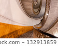Grand marble spiral staircase with ornate railings in Naples Italy 132913859