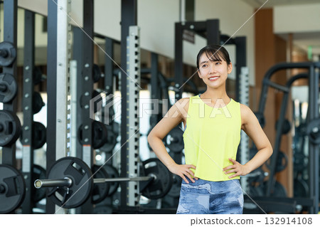 A young woman training at the gym. Photo courtesy of Sports Club & Sauna Spa Renaissance Makuhari 24 A young woman training at the gym. Photo courtesy of Sports Club & Sauna Spa Renaissance Makuhari 24 132914108