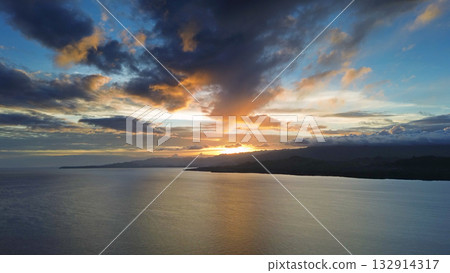 Sunset aerial over calm sea waters 132914317