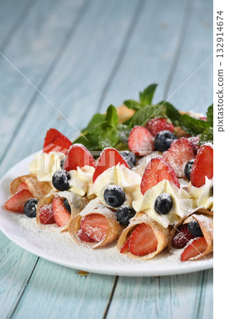 French crepes with cream and berries French crepes with cream and berries 132914674