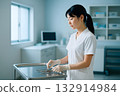 Nurse preparing medical equipment in the treatment room 132914984
