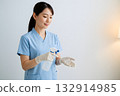 The careful actions of a nurse disinfecting her hands 132914985
