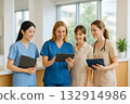 Nurses sharing information with colleagues 132914986