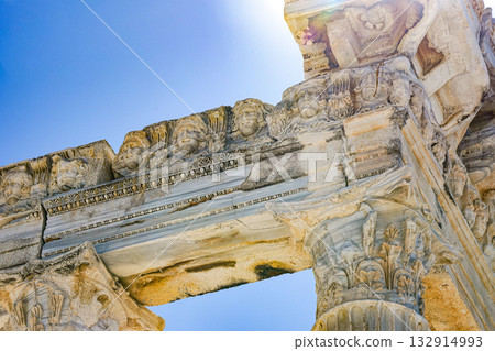 Ancient Stone Architecture Showcasing Intricate Details and Carvings in a Clear Sky Background Ancient Stone Architecture Showcasing Intricate Details and Carvings in a Clear Sky Background 132914993