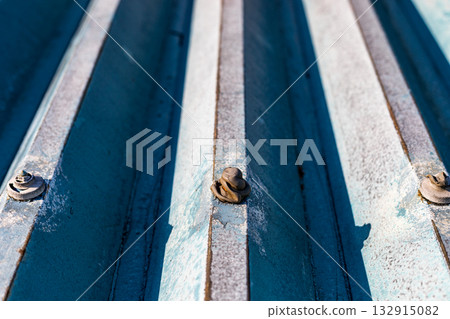 Repairing leaks from bolt caps on a warehouse's folded-plate roof Repairing leaks from bolt caps on a warehouse's folded-plate roof 132915082