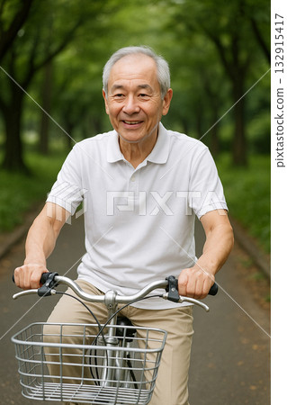 Senior man riding a bicycle with a smile 132915417