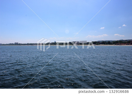 Sopot beach and city skyline viewed from the sea on sunny day 132916686