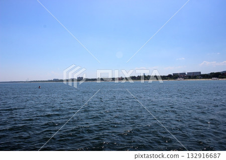 Sopot beach and city skyline viewed from the sea on sunny day 132916687