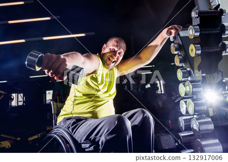 Disabled man training in the gym of rehabilitation center 132917006