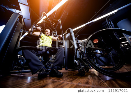 Disabled man training in the gym of rehabilitation center 132917021