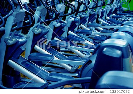 Modern gym interior with new cardio equipment. Modern gym interior with new cardio equipment. 132917022