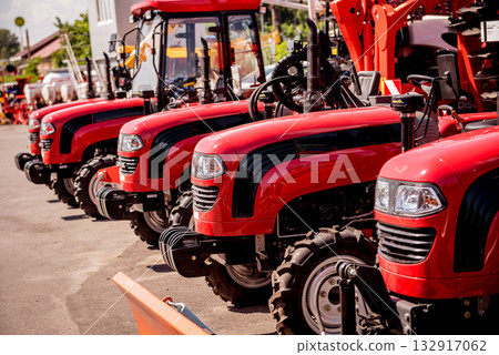 Rows of modern tractors. Industrial details. Agricultural  132917062