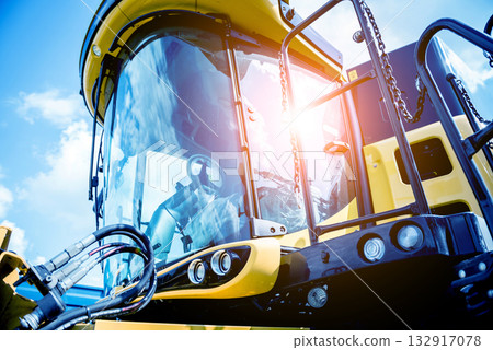 Modern agricultural machinery and equipment. Yellow agricultural harvester. Modern agricultural machinery and equipment. Yellow agricultural harvester. 132917078