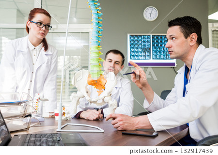 Doctors team having medical council in hospital.  132917439