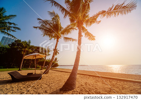 Beautiful tropical beach with palm trees. Sunrises and sunsets. Ocean. 132917470