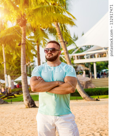 Young man on a tropical beach. Summer 132917471