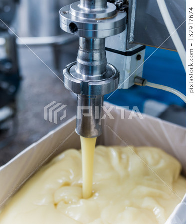 Bottling line of sunflower oil in bottles. Vegetable oil production plant. Bottling line of sunflower oil in bottles. Vegetable oil production plant. 132917674