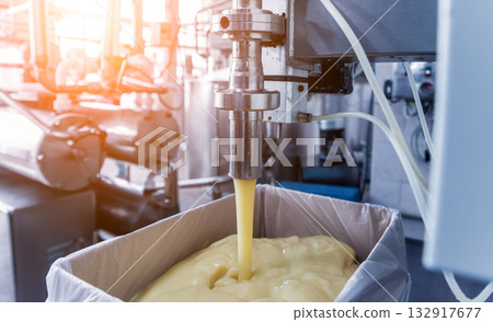 Bottling line of sunflower oil in bottles. Vegetable oil production plant.  132917677