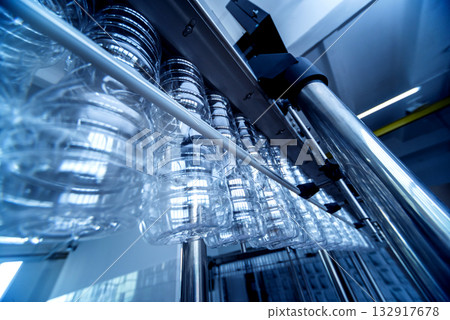 Bottling line of sunflower oil in bottles. Vegetable oil production plant.  132917678