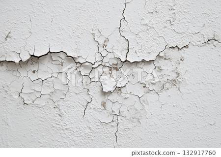 Cracked White Wall Surface Showing Signs of Age and Damage in a Residential Setting Cracked White Wall Surface Showing Signs of Age and Damage in a Residential Setting 132917760