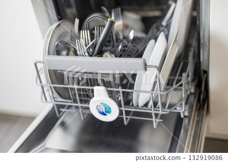 dishwasher with a bunch of dishes dishwasher with a bunch of dishes 132919086