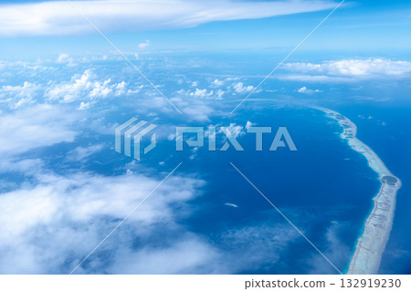 Aerial view of the Tuamotus atoll in French Polynesia with clouds 132919230