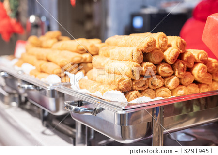 Croquettes with meat and mushrooms, a traditional Polish street food, are being prepared in the city center at the Christmas market in Krakow, Poland. Croquettes with meat and mushrooms, a traditional Polish street food, are being prepared in the city center at the Christmas market in Krakow, Poland. 132919451