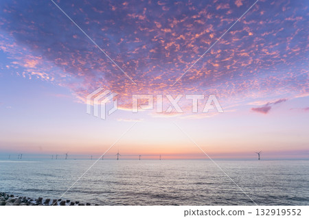 Stunning Sunset over Houlong Beach in Miaoli County Taiwan with Wind Turbines. Stunning Sunset over Houlong Beach in Miaoli County Taiwan with Wind Turbines. 132919552