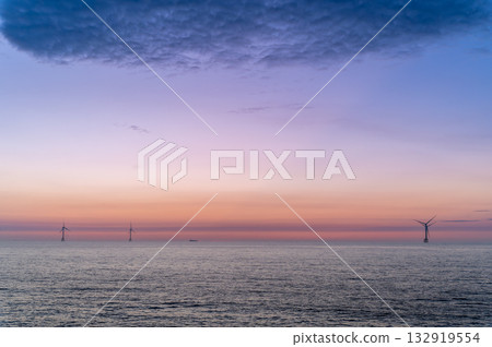 Stunning Sunset over Houlong Beach in Miaoli County Taiwan with Wind Turbines. Stunning Sunset over Houlong Beach in Miaoli County Taiwan with Wind Turbines. 132919554