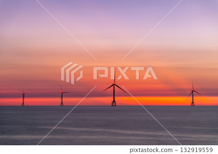 Vibrant Sunset with Wind Turbines at Houlong Beach Miaoli County Taiwan. Vibrant Sunset with Wind Turbines at Houlong Beach Miaoli County Taiwan. 132919559