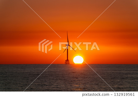 Sunset behind a wind turbine at Miaoli coastline in Taiwan. Sunset behind a wind turbine at Miaoli coastline in Taiwan. 132919561