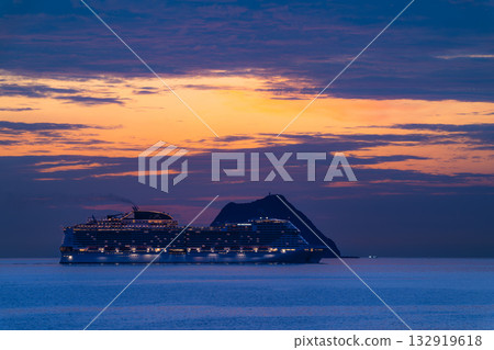 Luxury cruise ship sailing past Keelung Islet at Waimushan, Taiwan. 132919618