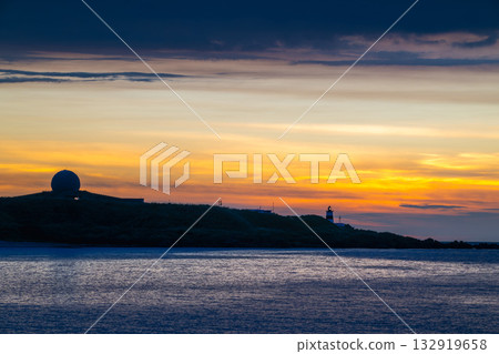 Dreamy Sunset Over Shimen Taiwan with Lighthouse and Moving Clouds. 132919658