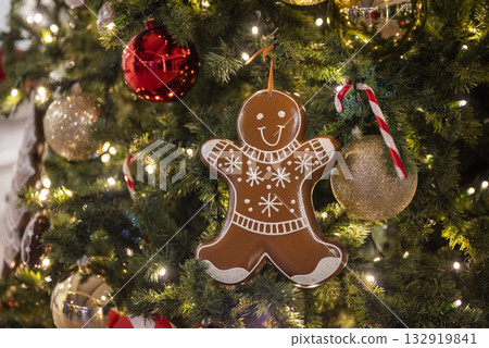 christmas tree for christmas with a garland and with decorations and with a gingerbread man christmas tree for christmas with a garland and with decorations and with a gingerbread man 132919841