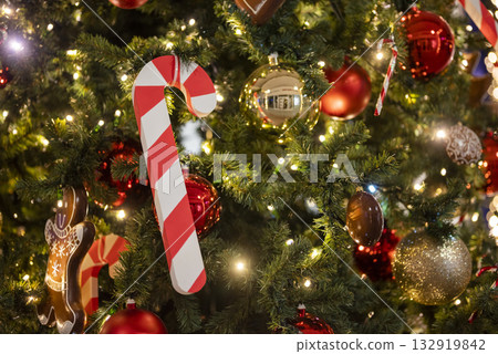 christmas tree for christmas with a garland and with decorations and candy cane santa claus christmas tree for christmas with a garland and with decorations and candy cane santa claus 132919842