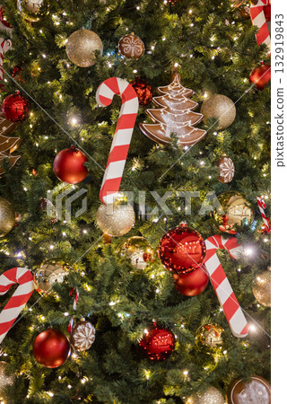 christmas tree for christmas with a garland and with decorations and candy cane santa claus 132919843