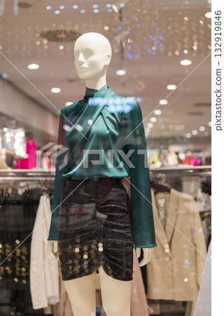 mannequins on display in a store with clothes in a shopping center 132919846