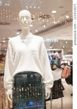 mannequins on display in a store with clothes in a shopping center mannequins on display in a store with clothes in a shopping center 132919871