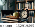 Old alarm clock, glasses, colored pencils and books on wooden table. Blurred background with bookshelves. Concept of advertising materials, education, reading, learning, time management. Copy space 132919895